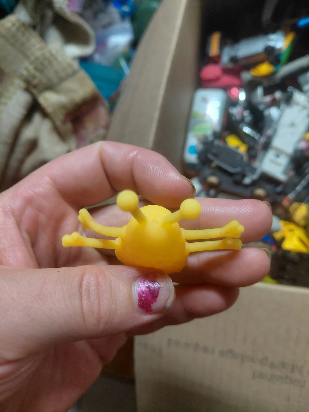 rubber alien monster finger puppet.